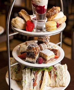 Afternoon tea tower with pastries and sandwiches